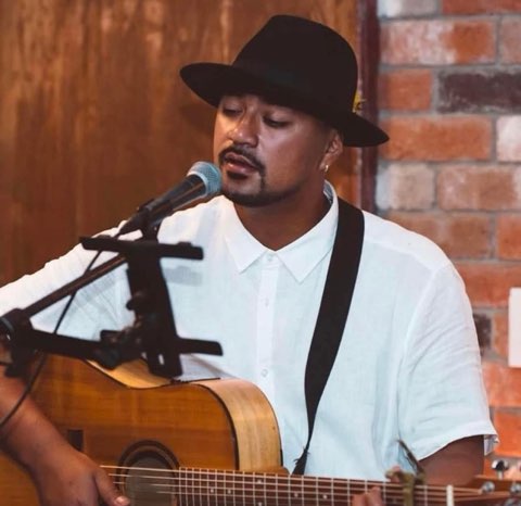 Live acoustic musician performing at the markets