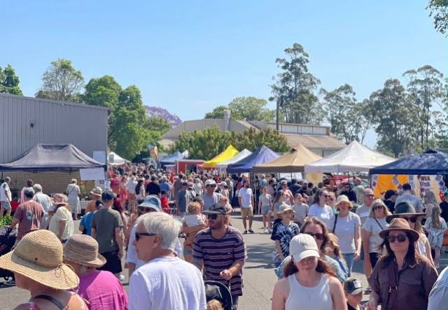 A friendly market stallholder with fresh local produce