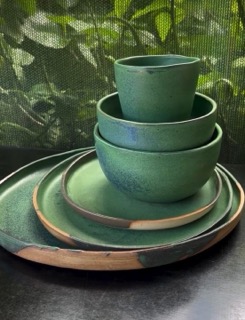 Locally made green ceramic bowls and plates