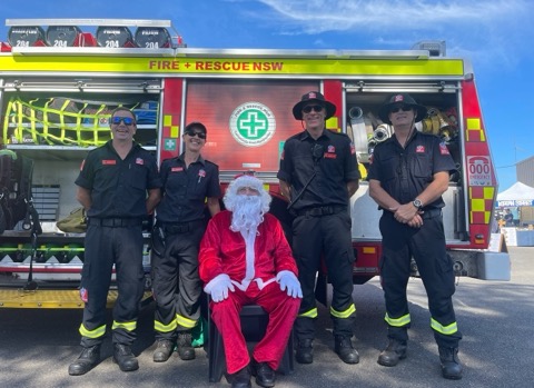 Fire and Rescue NSW crew with Santa at the markets